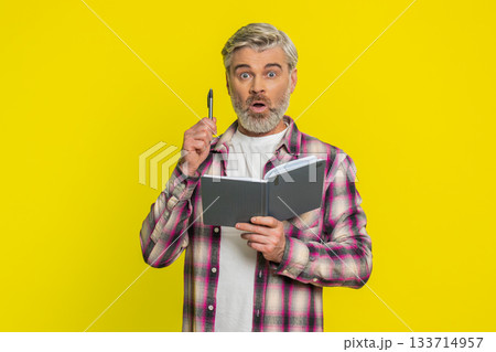 Mature man making notes writing thoughts with pen into notepad notebook diary to do list good idea Mature man making notes writing thoughts with pen into notepad notebook diary to do list good idea 133714957