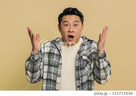 Excited amazed man surprise looking at camera with big eyes shocked by sudden victory wow emotion Excited amazed man surprise looking at camera with big eyes shocked by sudden victory wow emotion 133715030