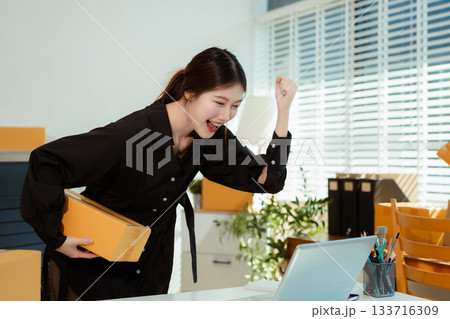 Successful Woman start up online seller at workplace. small business entrepreneur SME or freelance asian woman working with box at home. 133716309