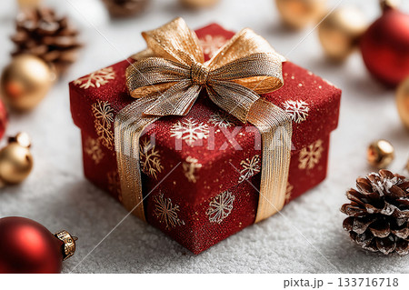 Holiday celebrations. Classic Red Gift Box with Gold bow on white background. Christmas decor. Holiday celebrations. Classic Red Gift Box with Gold bow on white background. Christmas decor. 133716718