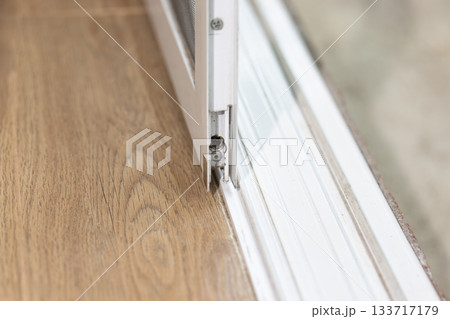 Aluminium sliding door that comes off bottom track. Aluminium sliding door that comes off bottom track. 133717179