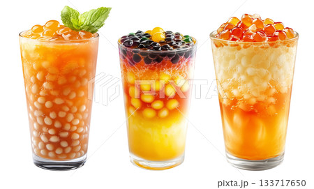Orange bubble tea Filipino Sagot Gulaman filled with tapioca pearls and topped with mint, isolated on white background. Orange bubble tea Filipino Sagot Gulaman filled with tapioca pearls and topped with mint, isolated on white background. 133717650