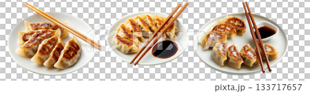 Golden pan-fried Japanese gyoza dumplings served on plate, isolated on white background, concept of Asian cuisine 133717657