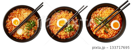 Delicious Korean ramen with boiled eggs, grilled pork, onions, and seaweed in black bowl isolated on white background 133717695