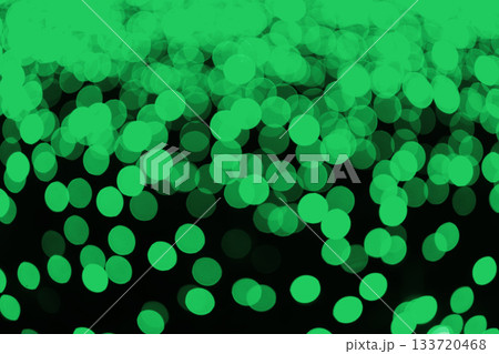 Abstract green bokeh lights, textured background with glowing circles on dark backdrop 133720468