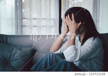 Sorrowful woman sat alone, overwhelmed by emotion, her sad and unhappy expression revealing deep despair, stress and distress left feeling depressed. sorrowful sad, despair alone, depressed stress Sorrowful woman sat alone, overwhelmed by emotion, her sad and unhappy expression revealing deep despair, stress and distress left feeling depressed. sorrowful sad, despair alone, depressed stress 133721236