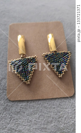 Handcrafted earrings made of beads and glass beads. Silver and gold hardware. Handcrafted earrings made of beads and glass beads. Silver and gold hardware. 133721371