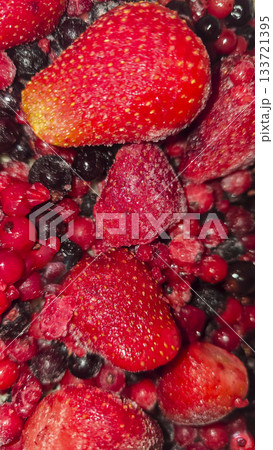 Frozen fruit. Fruit mix of currants and strawberries. Preserves for the winter. 133721395