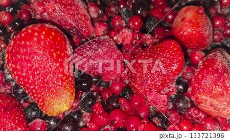 Frozen fruit. Fruit mix of currants and strawberries. Preserves for the winter. 133721396
