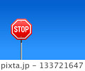 Stop road sign against the clear blue sky. Realistic illustration 133721647