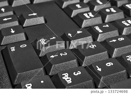 Black keyboard with numbers and arrows on the buttons Black keyboard with numbers and arrows on the buttons 133724698