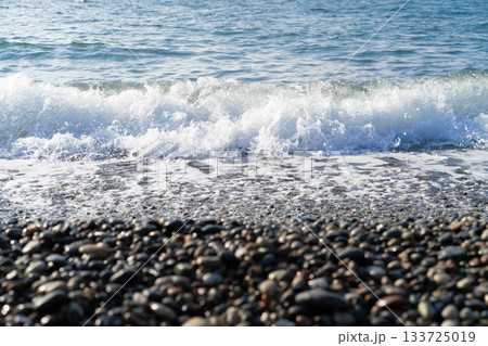 The view captures a stunning seascape with gentle waves lapping on a pebble beach, inviting you to indulge in luxurious spa treatments in a serene atmosphere. The view captures a stunning seascape with gentle waves lapping on a pebble beach, inviting you to indulge in luxurious spa treatments in a serene atmosphere. 133725019