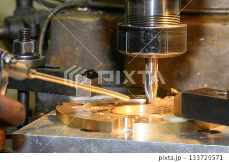 The hole boring  process on NC milling machine by flat nose end mill tool with brass ring parts. 133729571