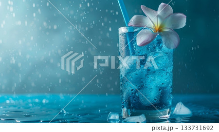 Savor a Refreshing Blue Beach Cocktail adorned with a Lemon Slice while relaxing by the Ocean under the sunny sky 133731692