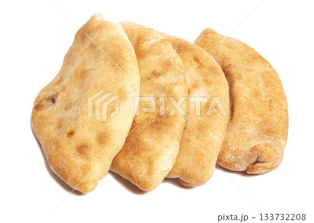 Pies with cabbage (pirozhki) isolated on white. Homemade baking Pies with cabbage (pirozhki) isolated on white. Homemade baking 133732208