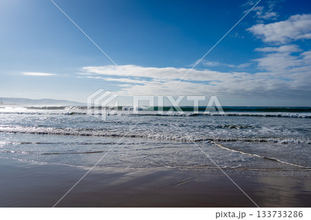 Sandy beach along the Great Ocean Road, Australia under cloudy sky 133733286