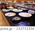 Buffet Cheese Platter Display With Sliced Cheeses and Tongs in Hotel Buffet Setting 133733356