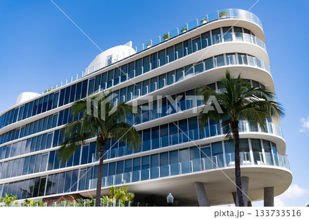 Perspective residential skyscraper. Modern skyscraper building. Architectural building in Miami beach. Skyscraper perspective view. Hotel architecture. Architecture of modern building Perspective residential skyscraper. Modern skyscraper building. Architectural building in Miami beach. Skyscraper perspective view. Hotel architecture. Architecture of modern building 133733516