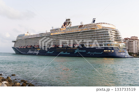 Miami, Florida, USA - November 01, 2024: Mein Schiff 1 Valletta. Cruise ship vacation. Cruise ship in summer vacation. Cruise ship vacation and travel at sea. Luxury liner illuminated in evening 133733519