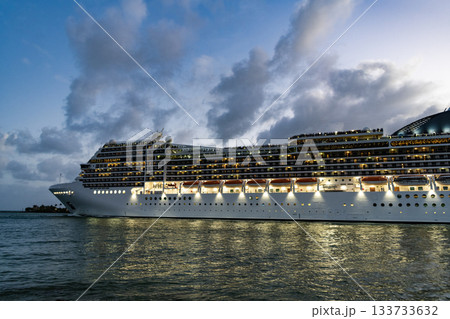 Majestic cruise ship in vacation summer. Cruise ship vacation and travel at sea. View of illuminated luxury liner. Ship at night port. Luxury sea vacation. Cruise ship vacation. Mood and Vibes Majestic cruise ship in vacation summer. Cruise ship vacation and travel at sea. View of illuminated luxury liner. Ship at night port. Luxury sea vacation. Cruise ship vacation. Mood and Vibes 133733632