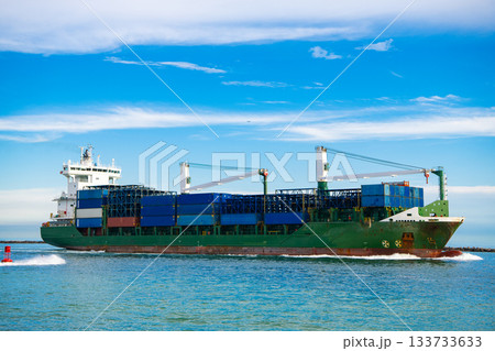 Miami, Florida, USA - June 06, 2024: Cargo ship Maersk Puelo with container in Miami. Freight container loaded on cargo vessel in Miami. Aerial view cargo ship entering harbor. Container ship. Miami, Florida, USA - June 06, 2024: Cargo ship Maersk Puelo with container in Miami. Freight container loaded on cargo vessel in Miami. Aerial view cargo ship entering harbor. Container ship. 133733633