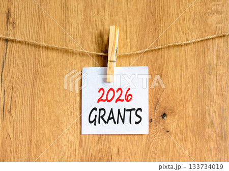 2026 Grants symbol. Concept words 2026 Grants on beautiful white paper on wooden clothespin. Beautiful wooden background. Business and 2026 grants concept. Copy space. 2026 Grants symbol. Concept words 2026 Grants on beautiful white paper on wooden clothespin. Beautiful wooden background. Business and 2026 grants concept. Copy space. 133734019
