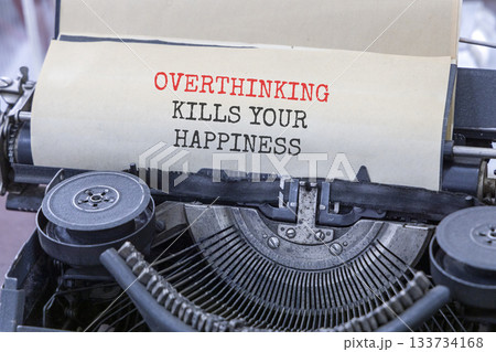 Overthinking kills your happiness symbol. Concept words Overthinking kills your happiness typed on old typewriter. Beautiful white background. Business overthinking kills happiness concept. Copy space Overthinking kills your happiness symbol. Concept words Overthinking kills your happiness typed on old typewriter. Beautiful white background. Business overthinking kills happiness concept. Copy space 133734168
