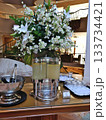 Elegant Beverage Station With White Flower Bouquet And Lemonade Dispenser At Reception 133734421