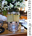 Lemonade Drink Station With Elegant Floral Arrangement At Catering Event Display 133734789