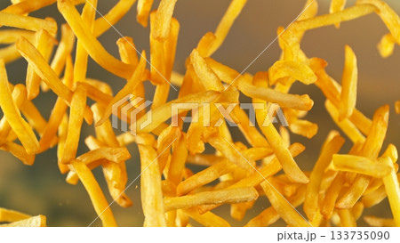 French Fries , Fried Potatoes Flying up in the Air . Concept of Junk Food 133735090