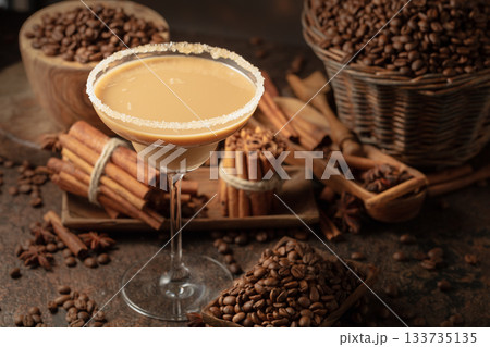 Chocolate martini cocktail or Irish cream liquor on a brown background. Chocolate martini cocktail or Irish cream liquor on a brown background. 133735135