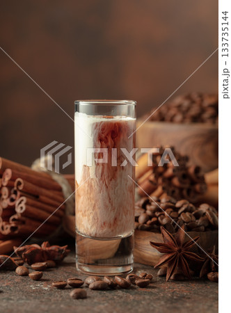 Cream and coffee liquor on a brown background. 133735144