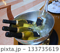 Luxurious Champagne Bottles Chilled in a Silver Ice Bucket for an Elegant Celebration Setting 133735619