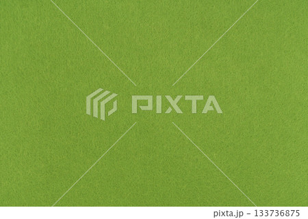 Light green felt texture background - close-up of soft fabric surface. Seamless background, graphic design, scrapbooking, textile layouts, creative projects. 133736875