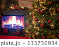 christmas tree for christmas with garland and decorations on blurred bokeh background with a fireplace 133736934