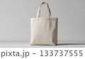 Minimalist Beige Canvas Tote Bag on Neutral Background for Eco-Friendly Lifestyle Concepts 133737555