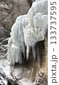 Frozen Icicle Cliff Partnachklamm: Dramatic Ice Formations Cascading Over Rugged Rock Wall by Water 133737595