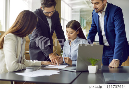 Group of business people having a meeting in office, signing a contract on workplace. Group of business people having a meeting in office, signing a contract on workplace. 133737634