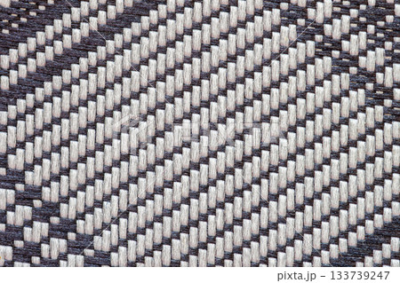 Handwoven fabric pattern with dark and white threads creating artisan textile design. Natural background, texture, copy space. Traditional weaving, craft handmade fabric Handwoven fabric pattern with dark and white threads creating artisan textile design. Natural background, texture, copy space. Traditional weaving, craft handmade fabric 133739247