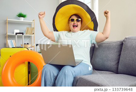 Happy excited overweight woman bought tickets at bargain price Happy excited overweight woman bought tickets at bargain price 133739648