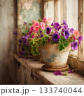 Colorful Flowers in a Pot on a Rustic Windowsill / 133740044