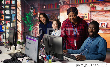 Portrait of smiling multiethnic call center agents helping customers regain access to accounts. Happy multiracial workers in diverse customer center assisting clients needing help, camera B Portrait of smiling multiethnic call center agents helping customers regain access to accounts. Happy multiracial workers in diverse customer center assisting clients needing help, camera B 133740383