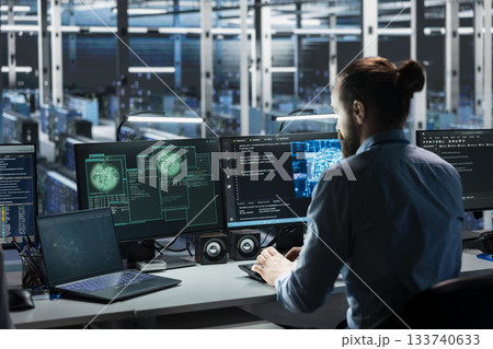 Data center engineer using AI assistant to manage global server infrastructure with international networks. Admin using artificial intelligence LLM to monitor worldwide system operations 133740633