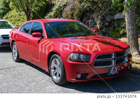 Seattle, WA, USA -July 3, 2024: 2013 Dodge Charger red front corner view Seattle, WA, USA -July 3, 2024: 2013 Dodge Charger red front corner view 133741074