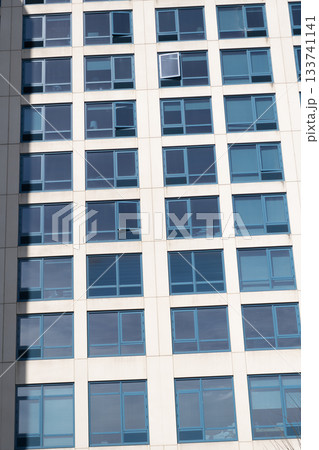 Window in building. Architectural detail. Background of architecture. Modern background. Modern facade background. Architecture. Building facade architecture. Building background. Window facade 133741141