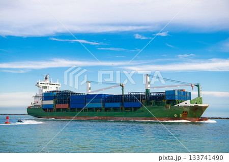 Container on barge at Port Miami. Cargo ship barge at harbor with container. Cargo ship barge in Miami Biscayne bay. Miami beach with barge in Biscayne bay. Cargo ship with container in Miami Container on barge at Port Miami. Cargo ship barge at harbor with container. Cargo ship barge in Miami Biscayne bay. Miami beach with barge in Biscayne bay. Cargo ship with container in Miami 133741490