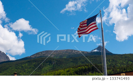Landscape panorama. Scenic landscape with mountain in nature. Travel destination. Alaska mountain peak view. American flag. Mountain landscape with American flag, copy space 133741493