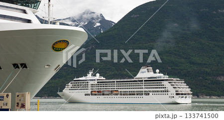 Skagway, Alaska, USA - July 23, 2019: Cruise ship vacation tour. Alaska harbor with cruise liner ship. Travel vacation tour. Travel destination. Seven seas mariner of Regent Seven seas cruises Skagway, Alaska, USA - July 23, 2019: Cruise ship vacation tour. Alaska harbor with cruise liner ship. Travel vacation tour. Travel destination. Seven seas mariner of Regent Seven seas cruises 133741500