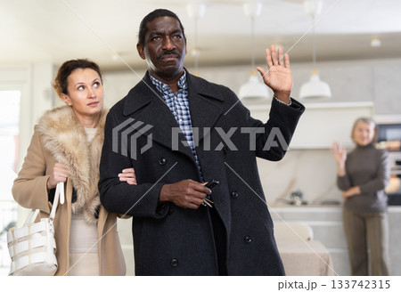 Elderly woman quarreling with man and woman couple Elderly woman quarreling with man and woman couple 133742315