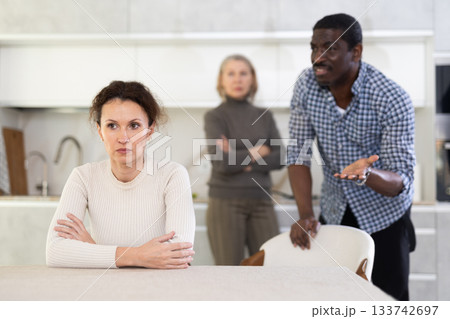 Adult man and elderly woman quarreling with woman 133742697